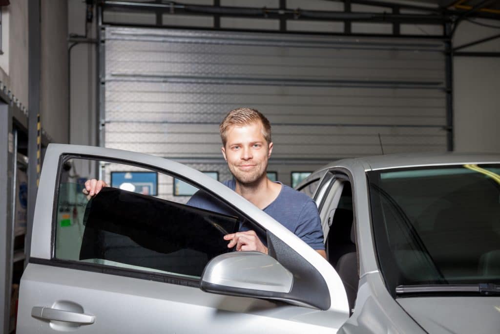 Applying tinting foil onto a car window